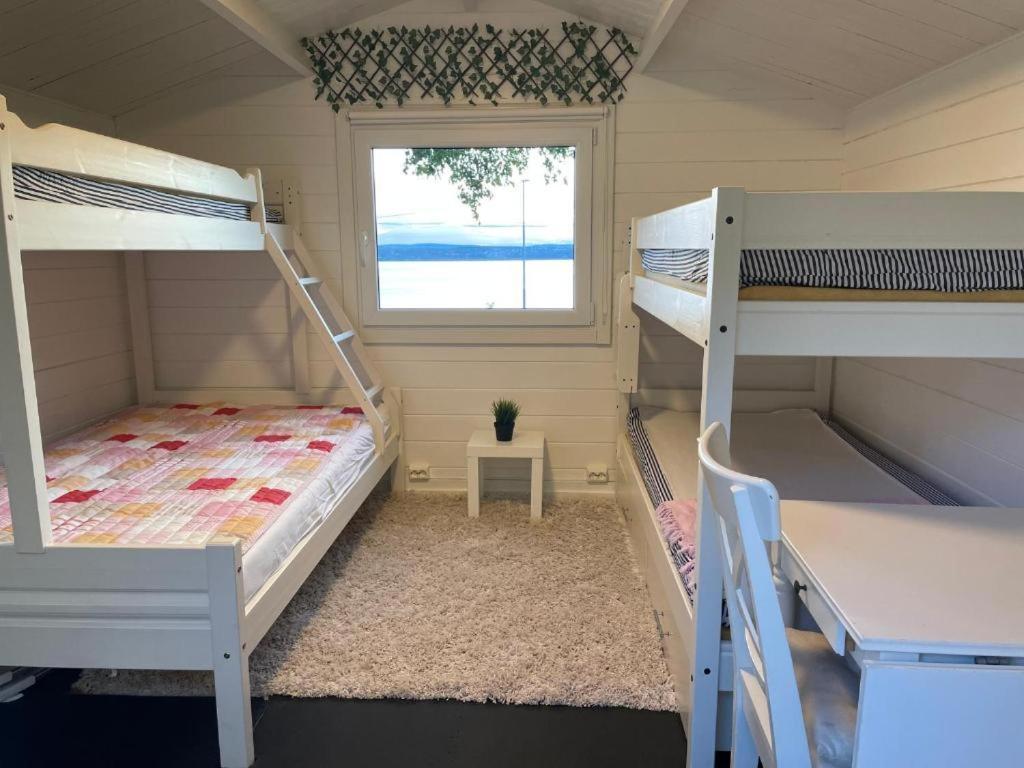 With1 Bedroom Separate Living With A Sofa Bed And A Tiny Kitchen A Bathroom Located In Nordstrand Near By The Sea For 3 Guests With A Garden And Grill 5 Extra Guests With Extra Cost In The With Sea View Just Outside The Apar Appartement Oslo
